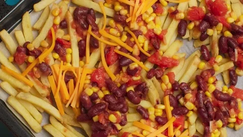 Flat lay cooking: making mexican food on the hot pan with beans, corn and fries Stock Footage 211096483