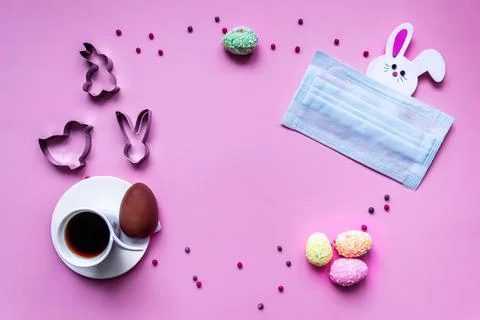 Flat lay of coronavirus quarantined easter composition. Easter eggs, coffee Stock Photos