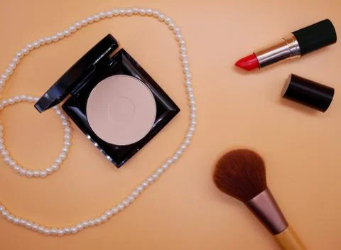 Flat lay cosmetics on orange background Stock Photos