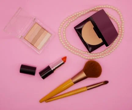 Flat lay cosmetics on pink background Stock Photos