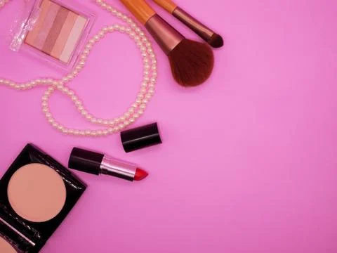 Flat lay cosmetics on pink background Stock Photos