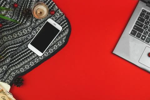 Flat lay cozy composition of workplace, workspace on red background with knit Stock Photos