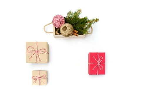 Flat lay craft boxes and box with rope, cinnamon, pine tree on white Stock Photos