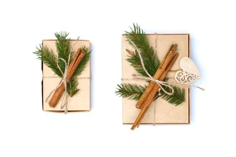 Flat lay craft boxes with pine tree, rope and cinnamon on white Stock Photos