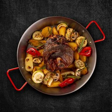 Flat lay of crispy roasted pork knuckle Stock Photos