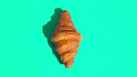 Flat lay of croissants motion pattern on a color background Stock Footage 124977004