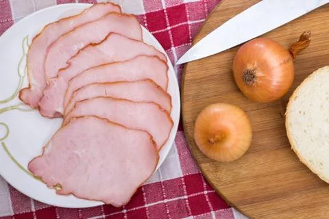 Flat lay cured meat served with onions Stock Photos