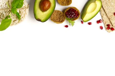 Flat lay with cut avocado with bread, biscuits and crispbread galette Stock Photos