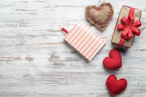 Flat lay cute composition with fabric heart Stock Photos