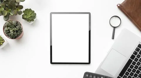 Flat lay desk elements arrangement with empty screen tablet. High quality photo Stock Photos