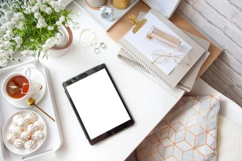 Flat lay desk table. Workspace with modern notebook, stationery, succulent Stock Photos