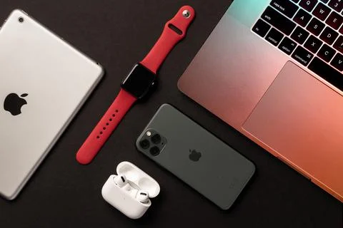 Flat Lay of different apple products on a grey background. Stock Photos