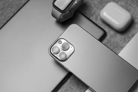 Flat Lay of different apple products on a grey background. Stock Photos