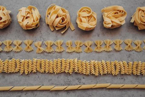 Flat Lay of Different Types of Pasta Laid Up on the Table Stock Photos