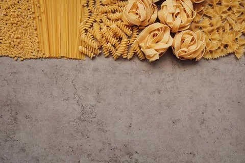 Flat Lay of Different Types of Pasta Laid Up on Top of the Table with Copy Space Stock Photos
