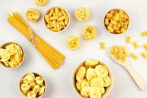 Flat lay with different types of traditional italian pasta. Penne, tagliate.. Stock Photos