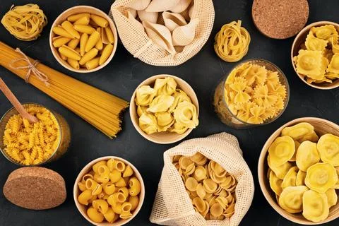 Flat lay with different types of traditional italian pasta. Penne, tagliate.. Stock Photos