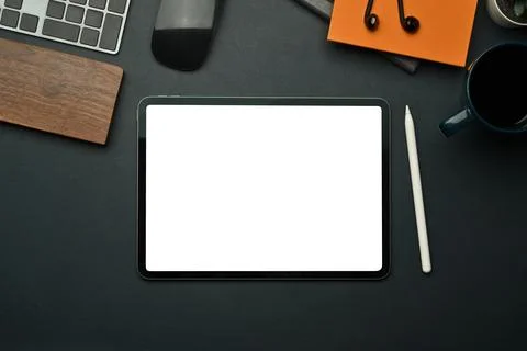 Flat lay digital tablet with empty screen, stylus pen, notebook and coffee cup Stock Photos