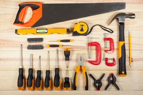 Flat lay display of a workman's toolkit on a wodden background Foto stock
