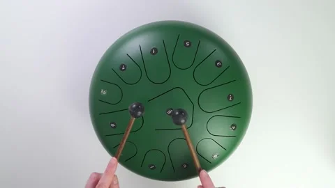 Flat lay drum round Glucophone round drum. layout tonal petal drum. Handpan Video stock 169560105