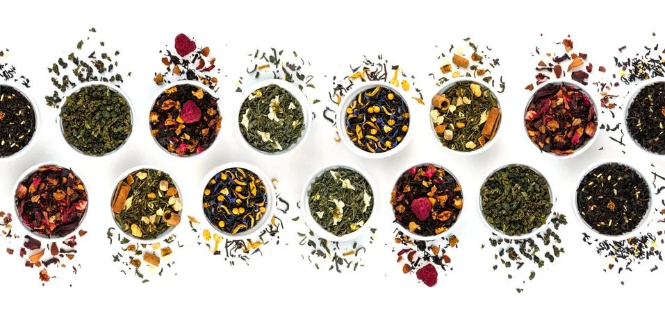 Flat lay dry tea pattern isolated on white background.. Healthy, organic drink Stock Photos