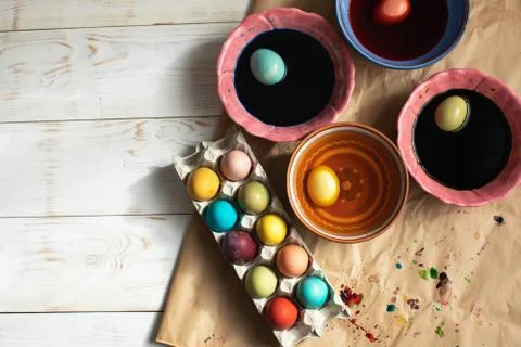 Flat lay  dyed Easter eggs with paints on table Stock Photos