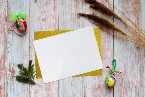 Flat lay Easter card with place for text. Colorful festive decorations eggs Stock Photos