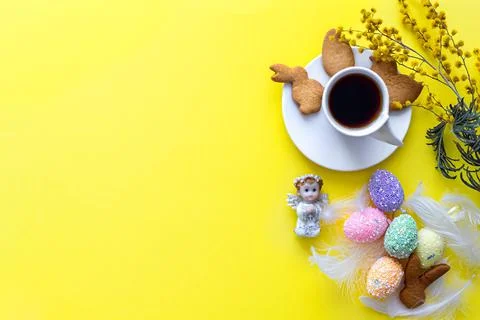 Flat lay of Easter composition on bright yellow background. Holiday concept Stock Photos