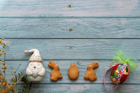 Flat lay easter composition with place for your text on blue wooden backgroun Stock Photos