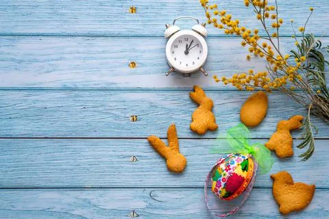 Flat lay Easter greeting card. Party supplies painted eggs and cookies Stock Photos