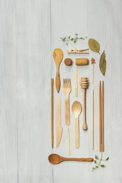 Flat lay of eco-friendly recyclable wooden Cutlery and accessories. Top view on Stock Photos
