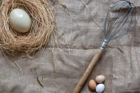 Flat lay eggs and eggbeater with copy space Foto stock