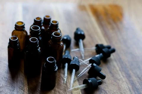 Flat lay of empty glass amber dropper bottles Stock Photos