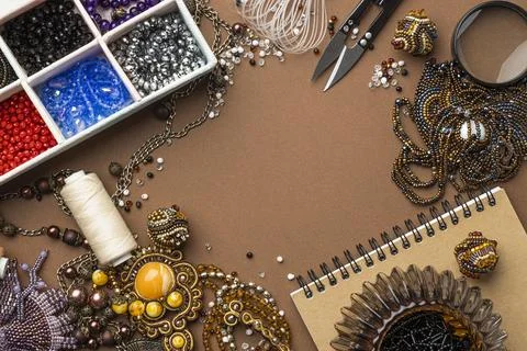 Flat lay essentials bead working with scissors notebook Stock Photos