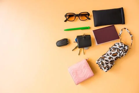 Flat lay of everyday essentials on a pastel background with copy space Stock Photos