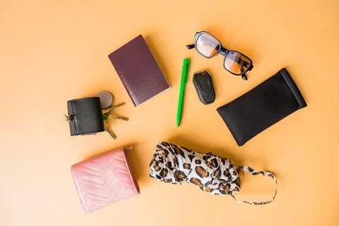 Flat lay of everyday essentials on a pastel background. Stock Photos