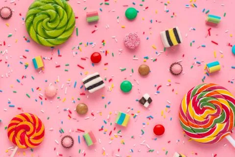 Flat lay of festive background with assortment of colourful caramel candies w Stock Photos