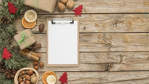 Flat lay festive christmas table arrangement with empty clipboard copy space Stock Photos