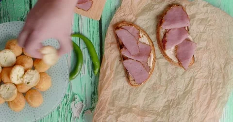 Flat lay food cooking: chef makes sandwiches with ham and jalapeno balls, 4k Stock Footage 219336909