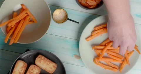 Flat lay food cooking: chef cookes crispy yam fries, 4k Stock Footage 219476465