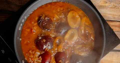 Flat lay food: making the hot sauce with plums and cinnamon, 4k Stock Footage 219340775