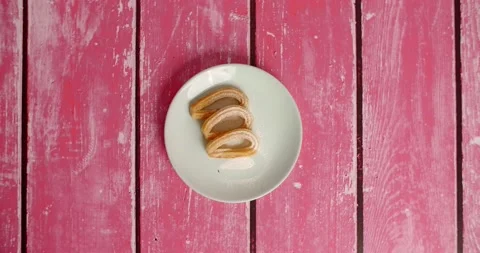 Flat lay food stop motion: churos appears on the plate Stock Footage 219475356