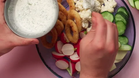 Flat lay food video: chef adds sauce to the vegetable salad, 4k Prores 422 Video stock 196340996