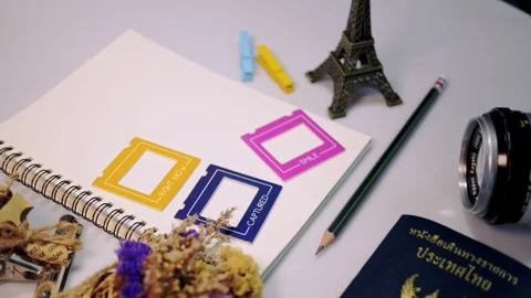 Flat lay footage of empty book and pencil for design work with small flower on w Stock Footage 91140505