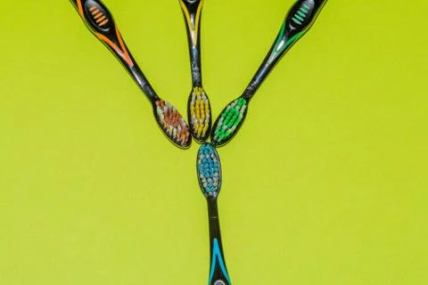 Flat lay of four toothbrushes Stock Photos