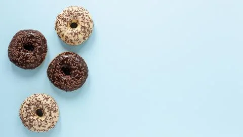 Flat lay frame with doughnuts copy space Stock Photos
