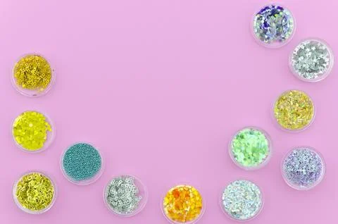 Flat lay framed Multi-colored Sequins for the design of nails in a Jar. Glitter Stock Photos