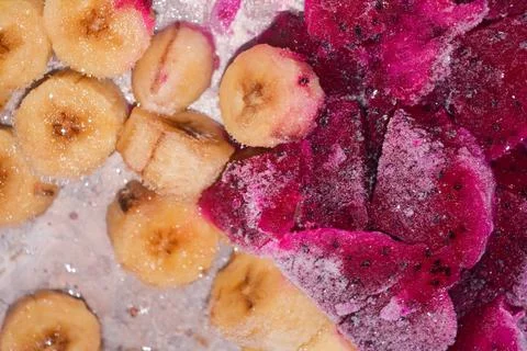 Flat lay fresh dragon fruit and bananas frozen in the freezer to make smoothi Stock Photos