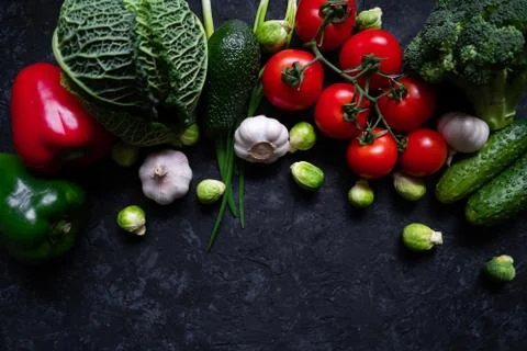 Flat lay of fresh vegetables isolated on black beton background. Raw healthy Stock Photos