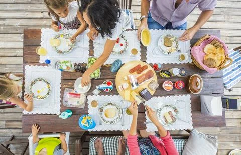 Flat-lay of friends eating  together. Top view of people having party, gather Stock Photos